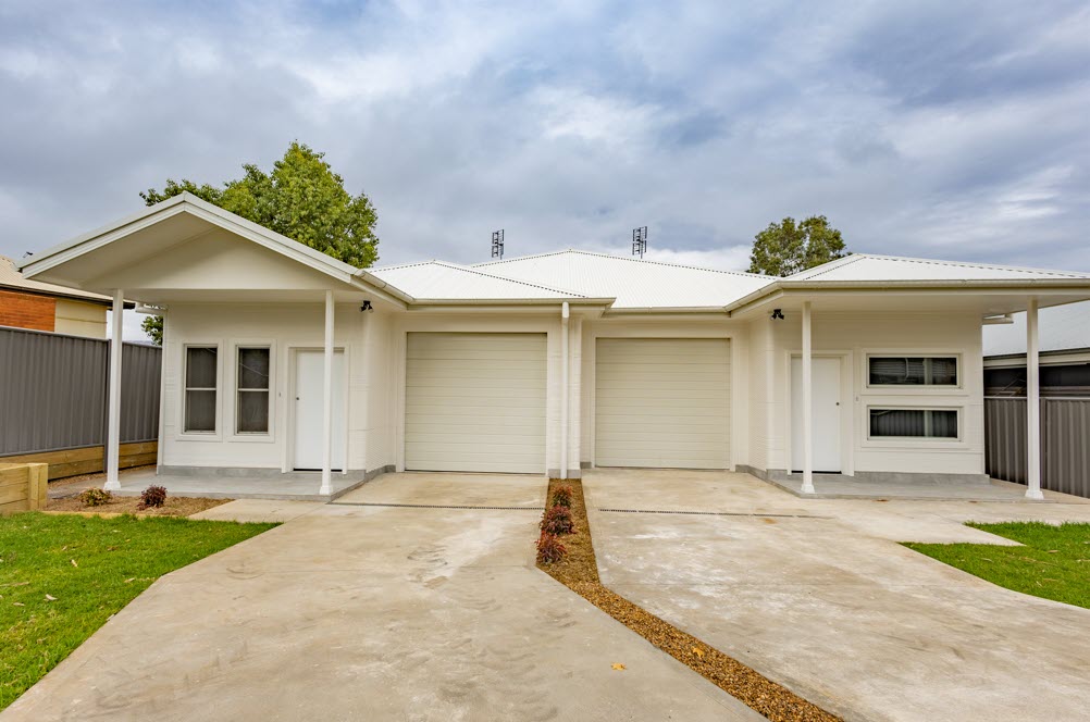 Completed white houses and garages
